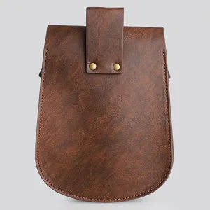 Detail view showing the textured brown leather and brass rivets of a Viking style pouch