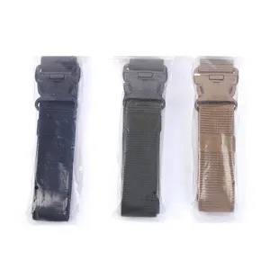Detailed view of three tactical canvas belts in black, green, and tan packaging