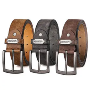 Detail showing three colors of women's vintage suede belts with metal buckles