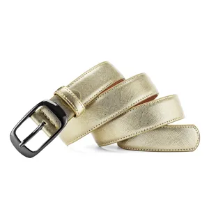 Gold saffiano texture leather belt detail featuring a sleek gunmetal oval pin buckle close up