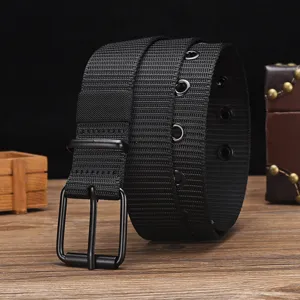 Detailed view of a black tactical canvas belt with a matte black metal pin buckle.