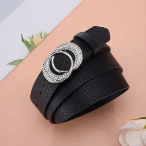 Close-up of black leather belt for women featuring a double-circle rhinestone buckle detail