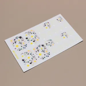 Close-up of spring daisy toe nail sticker sheet with holographic glitter accents