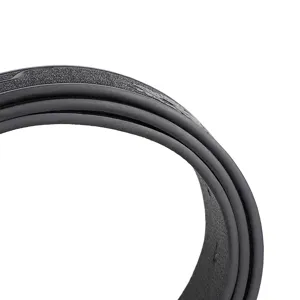 Men black leather belt detail close up, showing textured embossed surface and durable edge finish.