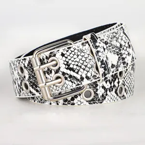 Detailed view of black and white snakeskin pattern belt featuring silver double buckle.
