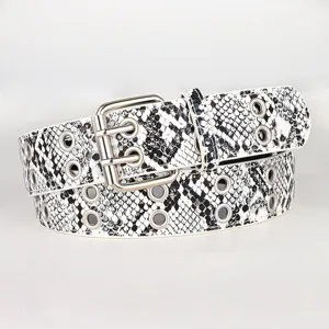 Close-up detail of the vintage black and white snakeskin pattern belt with metal grommets.