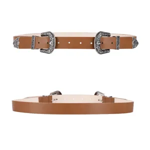Women's vintage brown leather belt with dual engraved buckles and classic western style