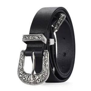 Detail of black retro belt featuring ornate engraved silver-tone buckle