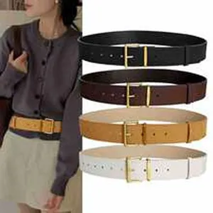 Detailed view of women's leather belts in black, brown, tan, and white options.