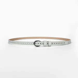 Detailed macro view of minimalist light blue hollowed-out breathable leather belt for women