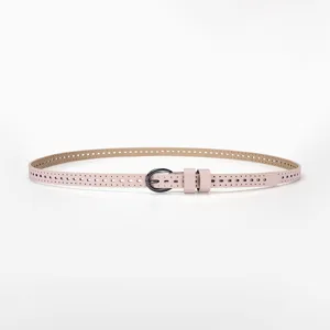 Close-up view of a pink thin women's belt featuring decorative hollow-out breathable patterns.