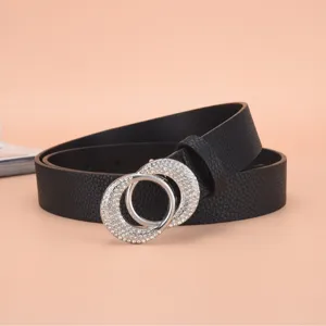 Detailed view of a black women's belt with a sparkling rhinestone double ring buckle.