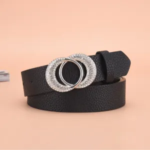 Detailed macro view of a women's black leather belt with double-ring rhinestone buckle