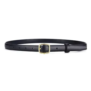 Close-up of a slim black leather belt featuring a classic gold rectangular buckle.