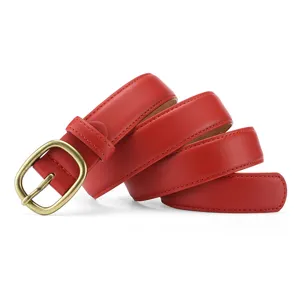 Close-up of a red leather belt featuring a vintage bronze pin buckle and fine stitching details.
