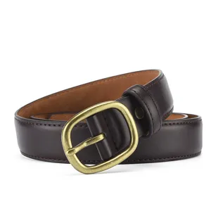 Detailed shot of dark brown women's leather belt with retro brass pin buckle and neat stitching.