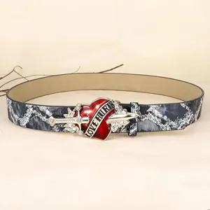 Vintage punk style leather belt with red heart dagger buckle and washed texture.