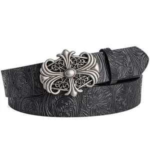 Detailed view of black embossed leather belt with ornate vintage silver cross buckle accessory.
