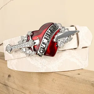 Close-up detail of punk style white belt with ornate red heart and dagger metal buckle.