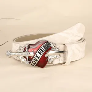 European retro punk style red heart dagger metal buckle white leather belt detail view.