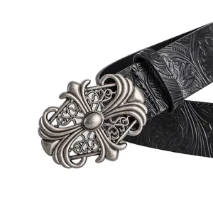 Detailed shot of a black embossed leather belt featuring an intricate vintage metal buckle.