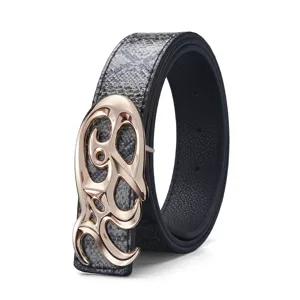 Detail of retro belt with snakeskin print and rose gold flame buckle