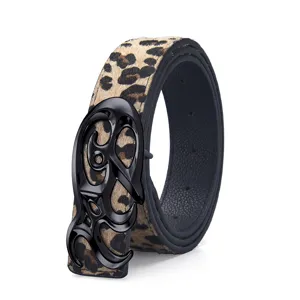 Close-up detail of vintage leopard print belt featuring a decorative black metal buckle