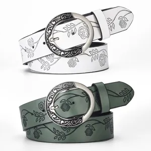 Vintage wide leather belt for women with floral pattern and ornate round buckle
