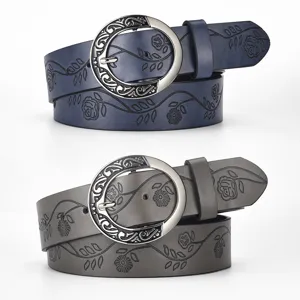 Retro floral embossed wide leather belt with ornate round buckle for women
