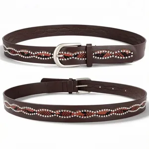 Detail showing the intricate snake pattern and silver stud embellishments on brown leather belt
