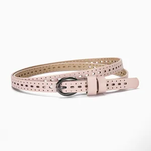 Close-up of the elegant pink hollow-out breathable skinny belt with a metal pin buckle
