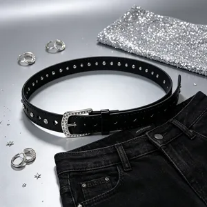 Detail view of black heart cutout belt with sparkly rhinestone buckle and studs