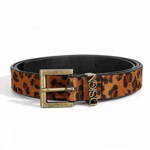 Detailed macro shot of a leopard print belt with vintage gold buckle and DSIGN slider