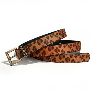 Macro view of the leopard print belt featuring a decorative D.SIGN buckle detail