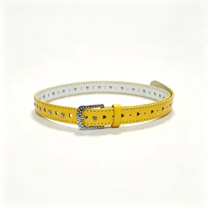 Detail of yellow belt featuring heart-shaped cutouts and rhinestone-studded buckle