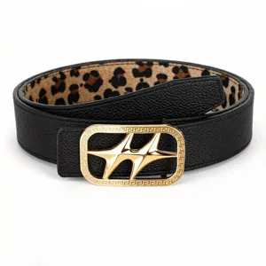 Cinturón reversible de cuero con hebilla de estrella dorada e interior de leopardo