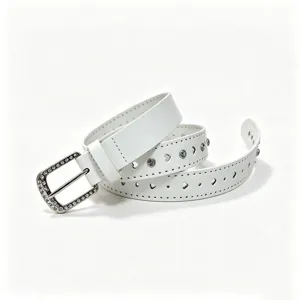 Detailed view of white glossy belt featuring heart cutouts and sparkling rhinestone buckle.