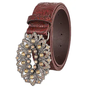 Vintage embossed leather belt featuring an ornate floral rhinestone hollow-out buckle detail