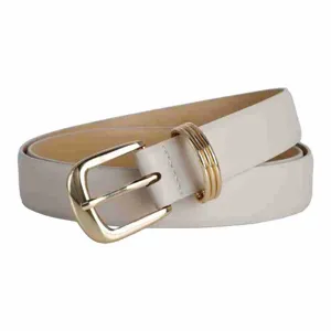 Close-up shot of white leather belt featuring polished gold buckle and triple ring.