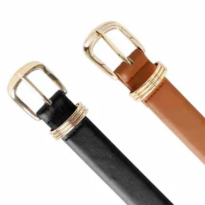 Close-up of slim leather belts with gold-tone metal buckles and triple loops for daily wear details.