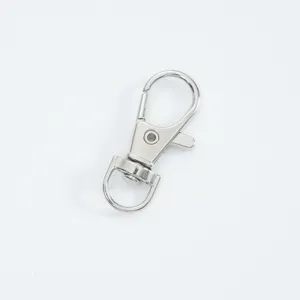 Detailed macro view of a silver alloy lobster swivel clasp for bag and key accessories