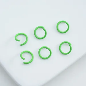 Macro view of lime green painted alloy jump rings for handmade DIY jewelry crafting