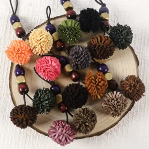 Retro PU leather tassel pom-pom charm with wooden beads for bag and shoe decoration.