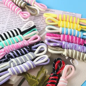 Detailed macro shot of colorful braided Roman knot ropes for DIY phone lanyards