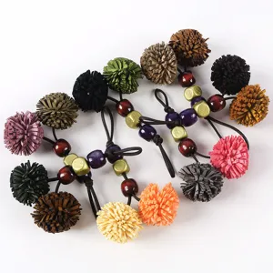 Retro PU dual-color fringe pom pom charm with wooden beads for bags and shoes decoration.