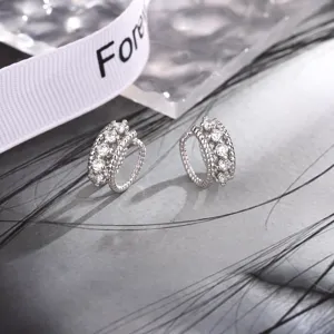 Macro view of silver double-layer twisted ear cuffs with shimmering cubic zirconia stones