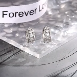 Detail shot of silver double-layered twist ear cuff with sparkling cubic zirconia