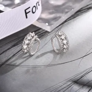 Elegant double-layered twisted silver ear cuff earrings set with sparkling cubic zirconia