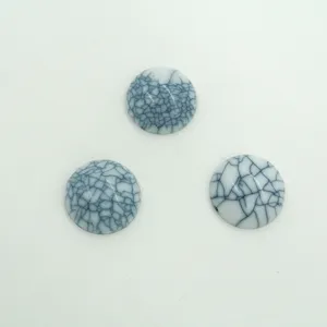 Close up detail of round flatback resin crackle cabochons faux turquoise jewelry DIY crafts