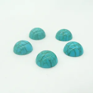 Close-up detail of turquoise imitation resin cabochon flatback rhinestones for DIY crafts.